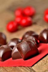 Close-up of cherry chocolate with a creamy filling liquor vertical photo
