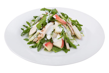 fitness salad of chicken, arugula and apple slices, with white sauce, on a plate, isolate