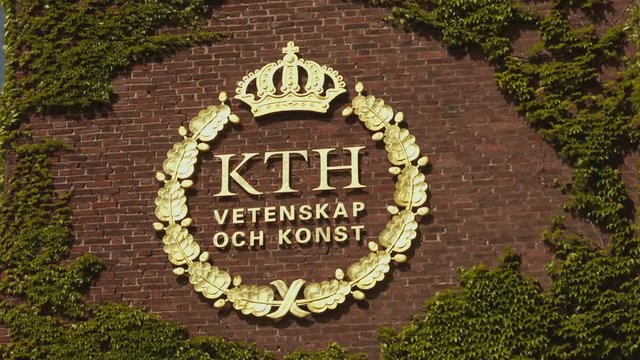 Science and art building sign surrounded by green ivy blowing in a breeze on a red brick wall. Golden letters and logo of KTH Royal Institute of Technology.