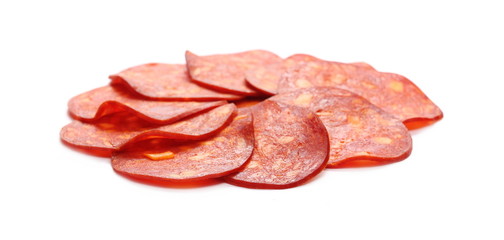 Spicy salami sausage slices isolated on white background
