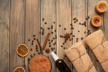 Spa still life, beauty and skin care. Coffee grains and spices with massage oil and towels, with space for designer