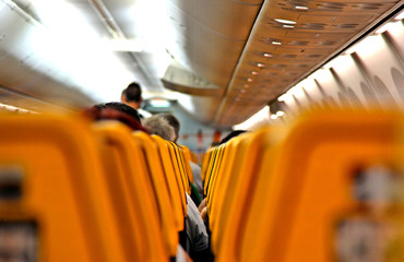 Ryanair Jet airplanes interior between the seats view. Ryanair is the biggest low-cost airline company in the world. 