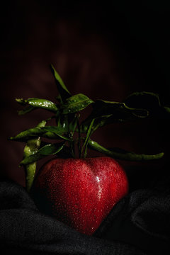 Raw Red apple on dark table
