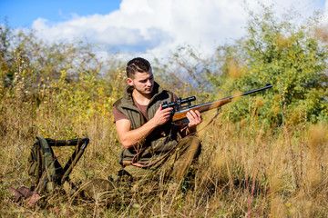 Hunting strategy or method for locating targeting and killing targeted animal. Man hunting wait for animal. Hunter with rifle ready to hunting nature background. Hunting skills and strategy