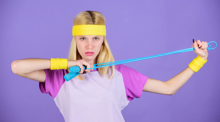 Proper approach to lose weight. Girl hold jumping rope wear bright wristbands. Woman exercising with jumping rope. Jumping challenge week. Weight loss concept. Jumping rope is great calorie burner
