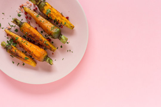 Healthy roasted carrots On colorful background