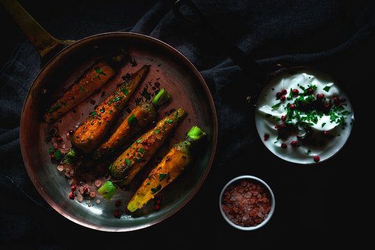 Healthy roasted carrots On dark background