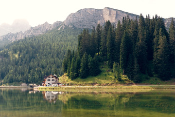 Fototapeta premium Auronzo di Cadore, Italy August 9, 2018: Misurina Mountain Lake. Beautiful tourist place with houses and cafes.