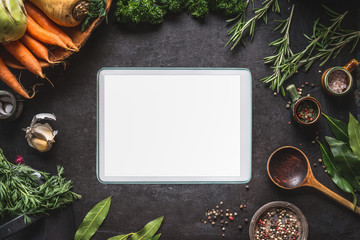 Food cooking and healthy eating background with  tablet pc with empty white screen. Fresh...