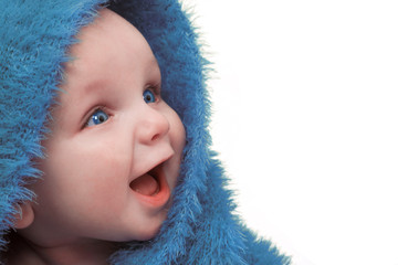 Smiling Happy Baby In Blue Blanket