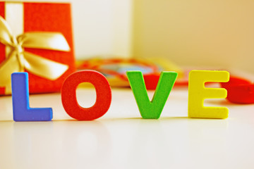 Valentine's day background. Valentine's day background - inscription in colored volume letters - I love you