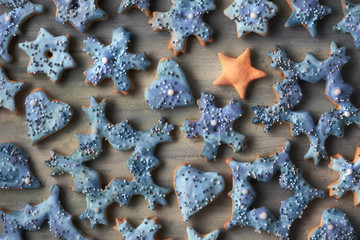 Christmas background, flat lay with snowflake and star cookies with sprinkled sugar on wood