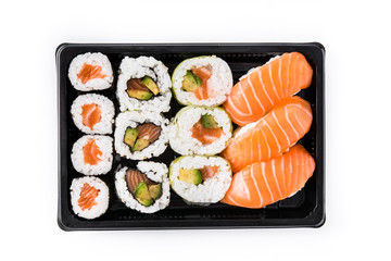 sushi assortment on black tray isolated on white background. Top view