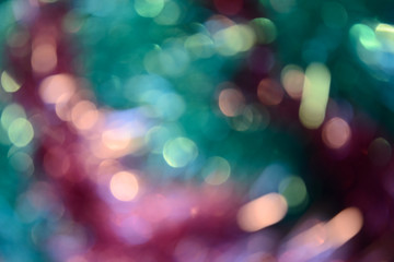 Bokeh photo. Holiday background. Christmas lights. Defocused sparkles. New Year backdrop. Festive wallpaper. Blinks. Carnival. Bokeh retro style photo. Pink.