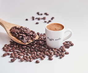 Obraz premium Close up coffee beans and Turkish coffee white table. Background coffee beans.