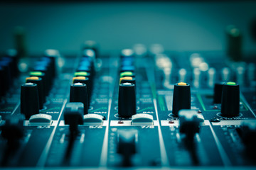 Closeup some part of audio mixer, vintage film style, music equipment concept