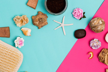 Spa beauty cosmetics items on colorful pink and blue background with copy space for text