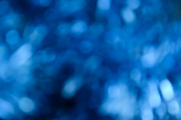 Bokeh photo. Holiday background. Christmas lights. background. Defocused sparkles. New Year...