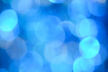 Bokeh photo. Holiday background. Christmas lights. background. Defocused sparkles. New Year...