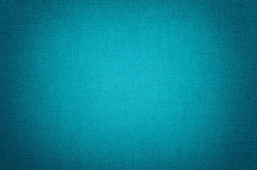 Blue background from a textile material with wicker pattern, closeup.