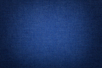 Navy blue background from a textile material with wicker pattern, closeup.