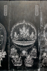 Exquisite statues carved on the black marble in Jijue Temple, China