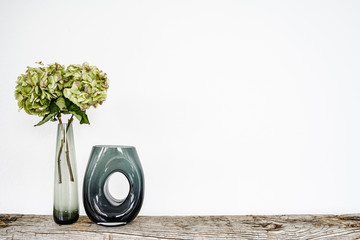 flowers and vase on a board