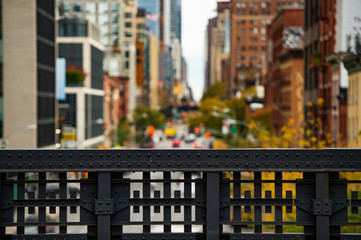 (selective focus) Blurred view from the High Line, Street traffic and buildings in Chelsea, New...