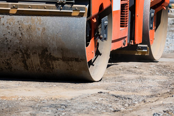 Road roller compactor at asphalt road repairing