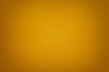 Golden background from a textile material with wicker pattern, closeup.