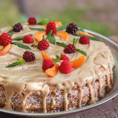 vegan raw cake with berries peach, mint and cashew cream