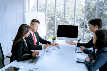 Young business people are presented marketing work project to the customer in meeting room office