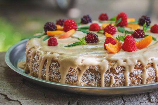 vegan raw cake with berries peach, mint and cashew cream - Powered by Adobe