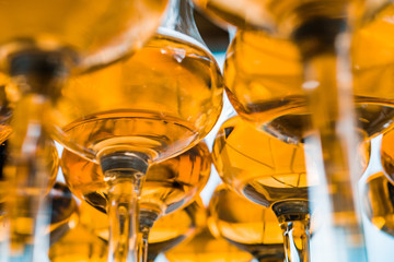 Dear Scotch whiskey in branded glasses on a high leg.