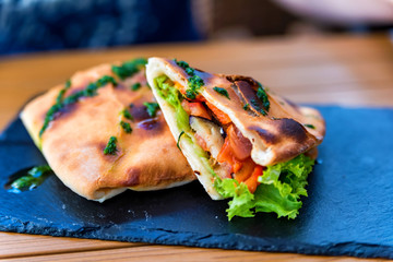 Fresh tortilla with stuffing on a plate