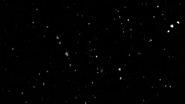 snow falls slowly in night winter. 4K