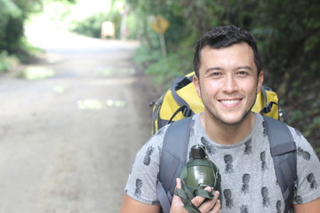 Healthy backpacker going through the jungle