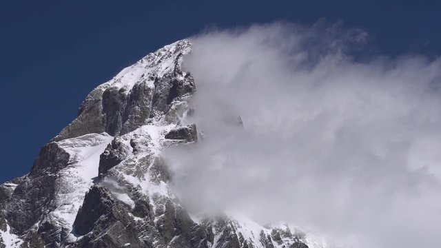 Clouds stopping at Ushba while hiking from Mazeri to Mestia in June, Svaneti Georgia