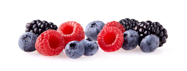 Fresh ripe berry in closeup. Raspberry, blueberry, blackberry on white background.