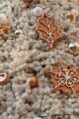 Cookie and ball on white christmas tree.