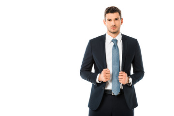 confident handsome businessman in suit holding jacket isolated on white