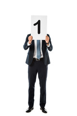 businessman with obscure face holding poster with number 1 isolated on white