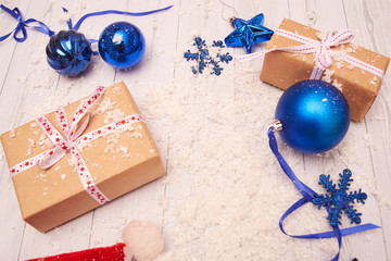 christmas gift box with balls on white background