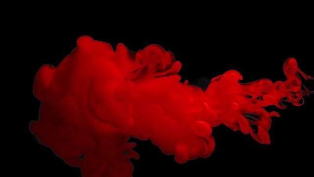 Red color paint ink drops in water slow motion full hd video black background with copy space. Inky cloud swirling flowing underwater. Abstract isolated smoke explosion
