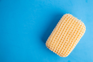 sponge with esparto to exfoliate in bathroom