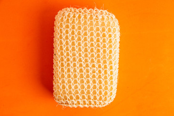 sponge with esparto to exfoliate in bathroom