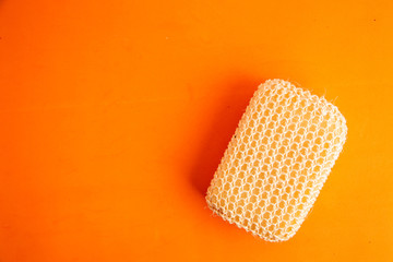 sponge with esparto to exfoliate in bathroom