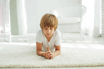 Child  lying on the carpet  