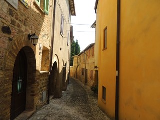 Typical Medieval alley of Montefalco, a town in Umbria that is famous for the red wine "Sagrantino" production.