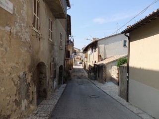 Fototapeta na wymiar Typical Medieval alley of Montefalco, a town in Umbria that is famous for the red wine 